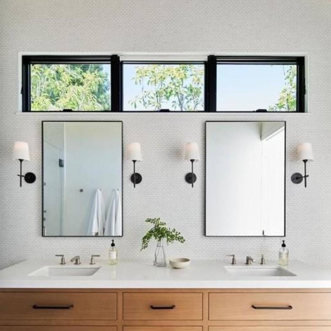 Bathroom vanity lights mounted on either side of a mirror